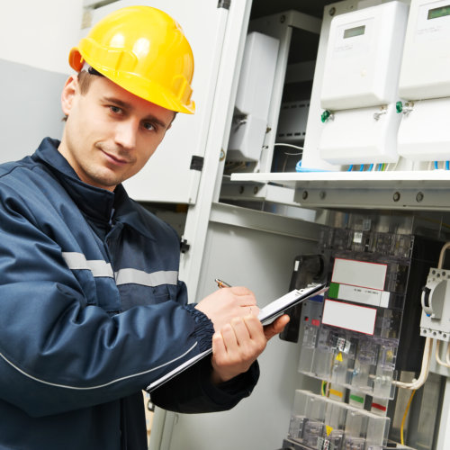 man holding folder in front of the circuit breaker