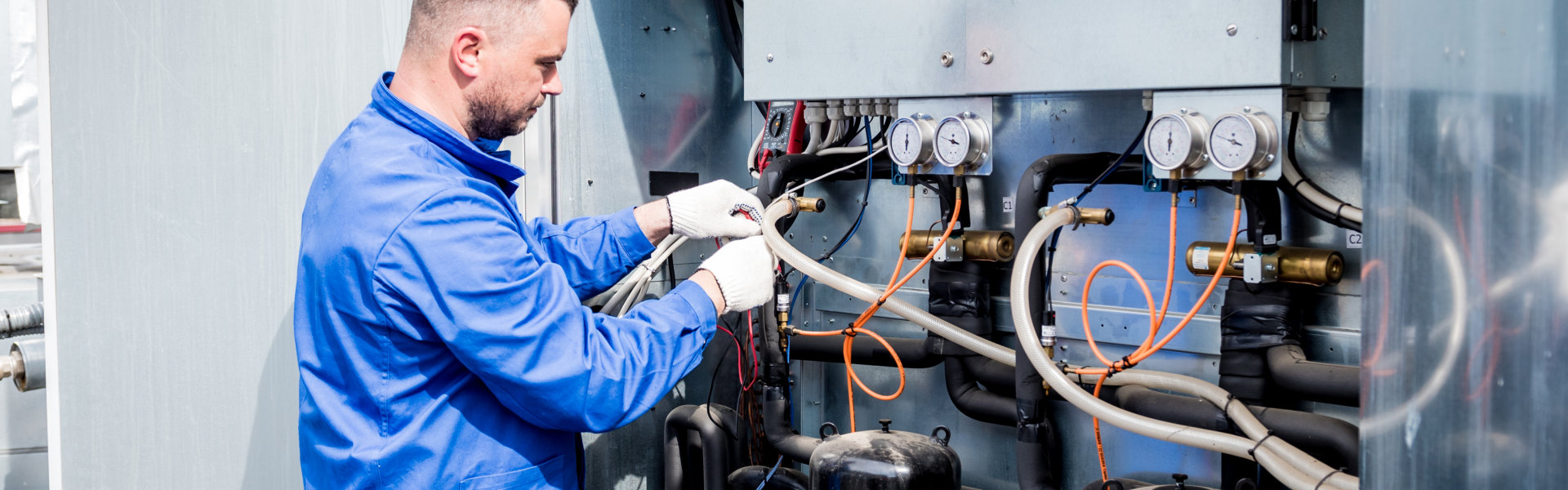 man repairing a breaker