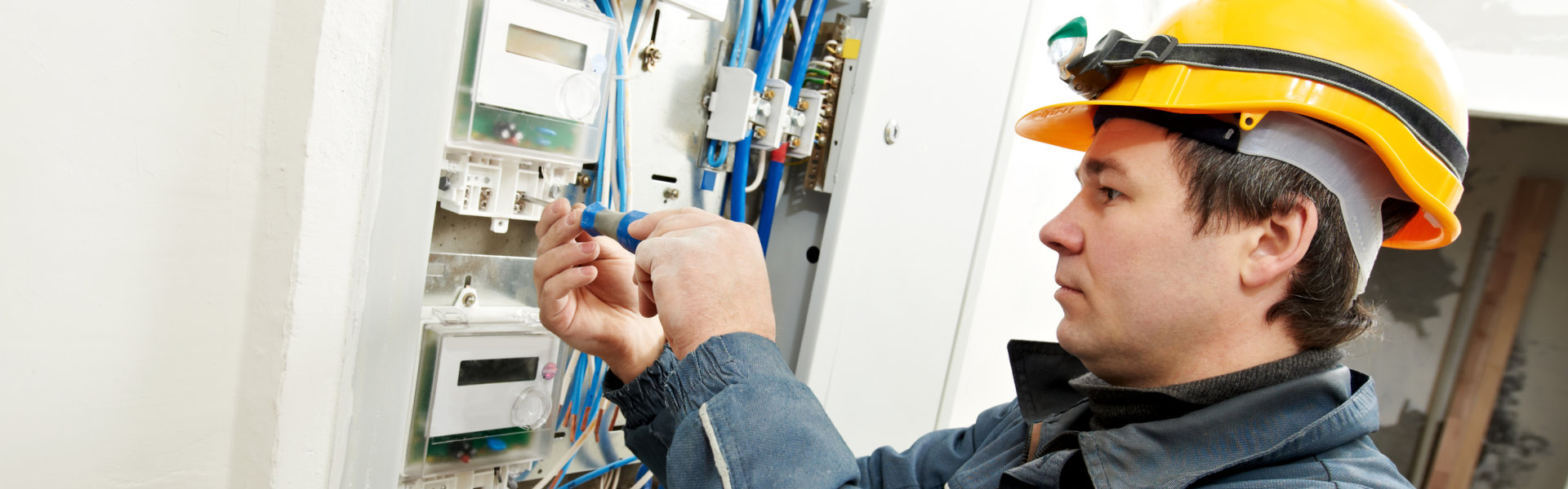 man repairing the circuit breaker